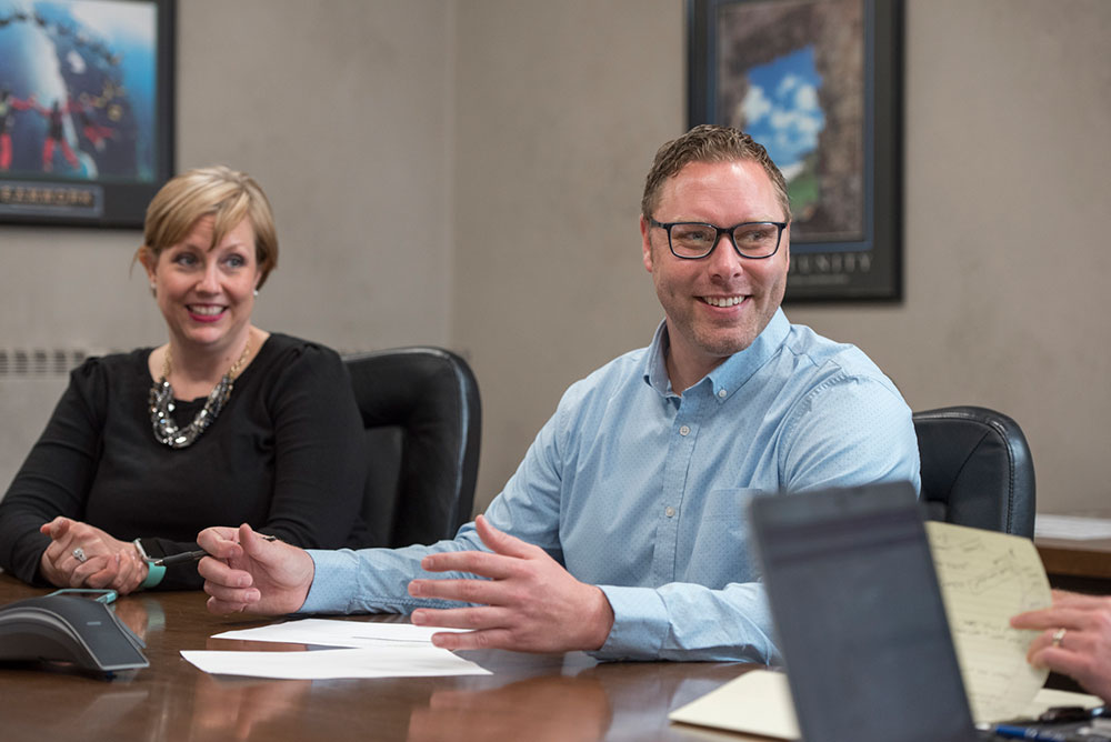 Employees smiling during meeting