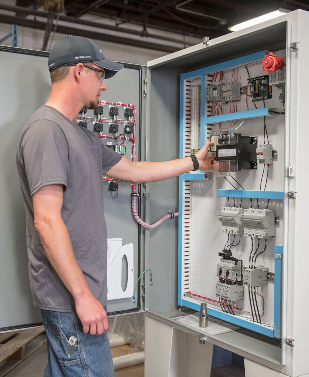 Employee working on electrical panel