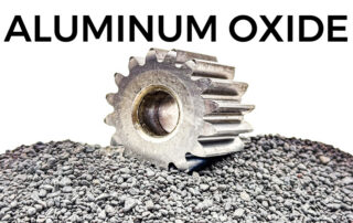 a gear used in aerospace manufacturing has been deburred using aluminum oxide abrasives