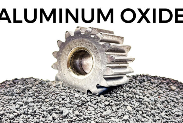 a gear used in aerospace manufacturing has been deburred using aluminum oxide abrasives