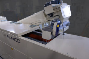 The Thru Feed Media Return Conveyor