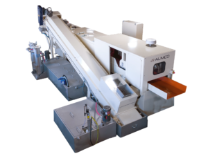 The back of a thru-feed vibratory tub system with additional sound dampening features.